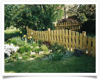 Custom design garden fence surrounding a pond in Wilford